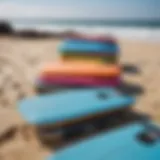 Various boogie boards displayed on a beach