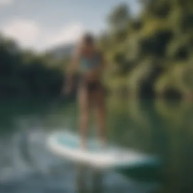 A beginner practicing paddle boarding techniques in a serene environment