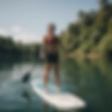 A beginner practicing paddle boarding technique on calm waters.