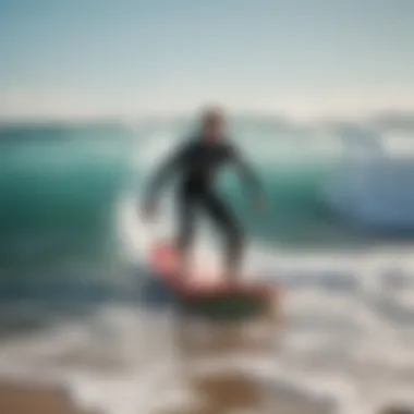 Person surfing with a bodyboard in ocean waves