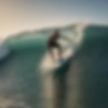 Surfer riding a wave with a six-foot surfboard.