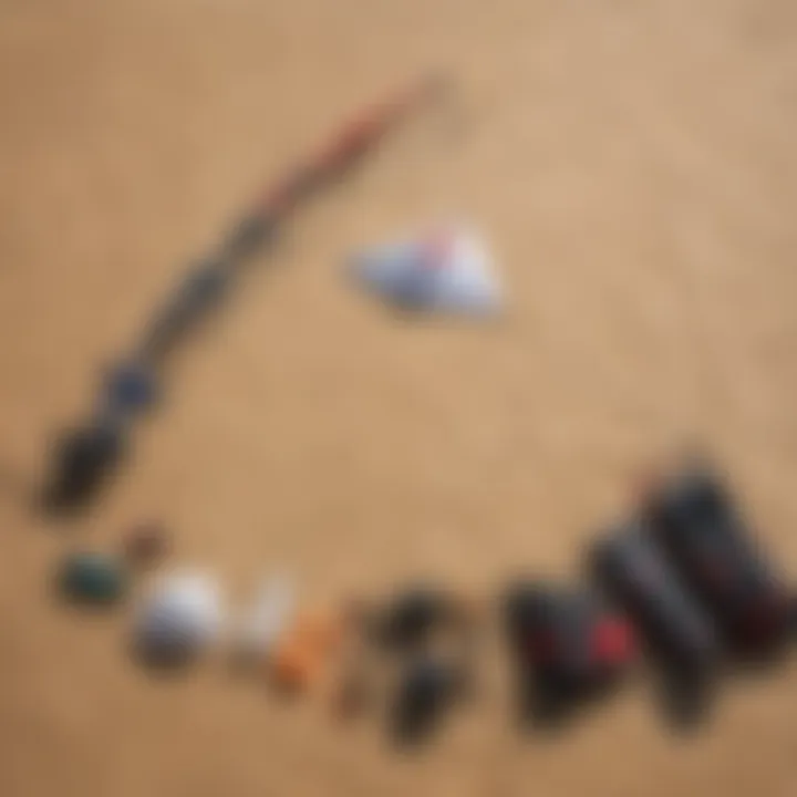 A detailed view of essential kite sailing gear laid out on a sandy beach.