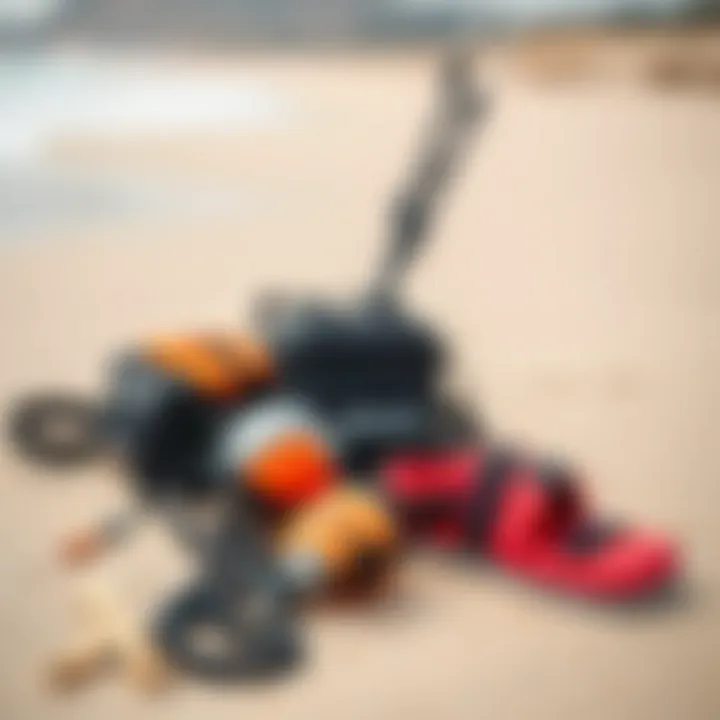 A close-up of essential kitesurfing gear laid out on the sandy beach ready for adventure.