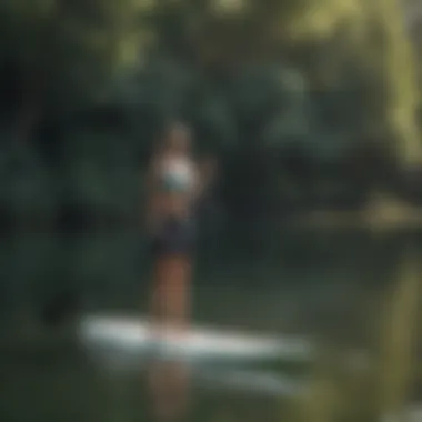 Stand-up paddleboarder on a serene lake