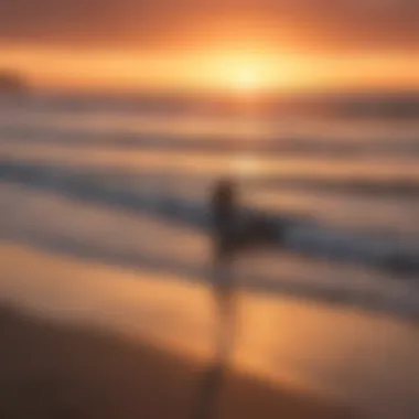 Beautiful sunset over Pacific Beach with surfers silhouetted