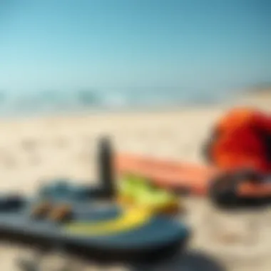 Essential kite surfing gear laid out on a sandy beach ready for use