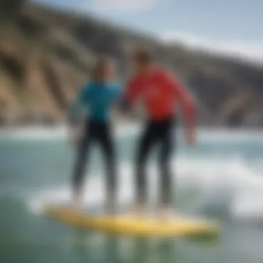 A surf instructor guiding a student on proper techniques