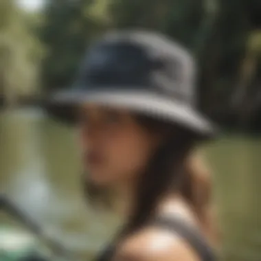 Person wearing Billabong bucket hat while kayaking