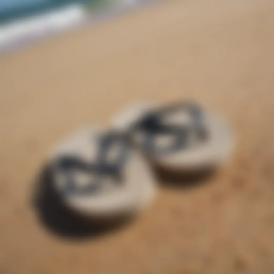 A stylish pair of surf flip flops on a sandy beach