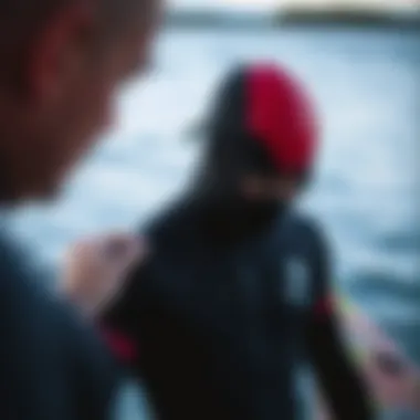Person ensuring proper wetsuit fit