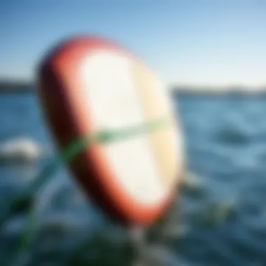 Evaluating Wear on a Used SUP Foil Board Side view of a used SUP foil board highlighting wear and tear