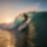 A breathtaking view of a surfer catching a wave at sunset