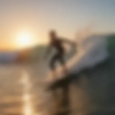 Surfer catching a wave at sunrise in Malibu