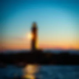 A lighthouse illuminating the shoreline at dusk