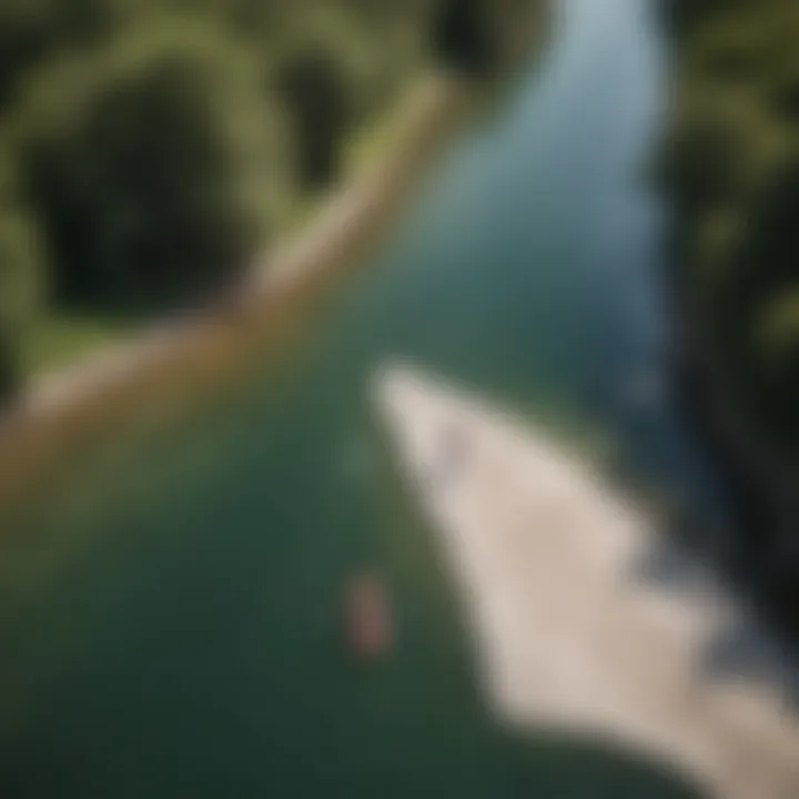 An aerial view of a paddle boarder plotting a route on a map beside a river