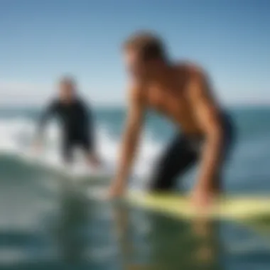 Expert Guidance in Surfing Techniques Instructor providing guidance to a learner on the waves