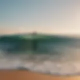 Surfing at sunrise on a pristine beach