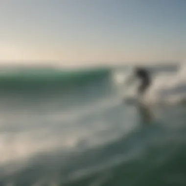 Surfers riding waves influenced by wind