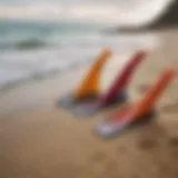 Close-up view of surf swim fins on a sandy beach