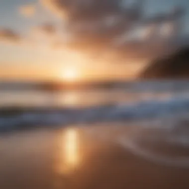 A serene beach setting with gentle waves lapping against the shore at sunset.