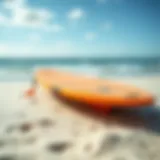 A vibrant boogie board on a sandy beach